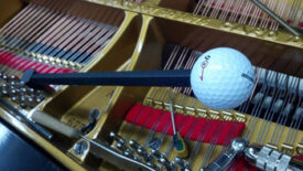 Piano tuning ball on the strings of a piano.